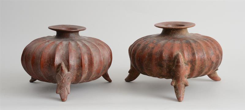 Appraisal: TWO SIMILAR PRE-COLUMBIAN STYLE POTTERY TRIPOD VESSELS Each squat spherical