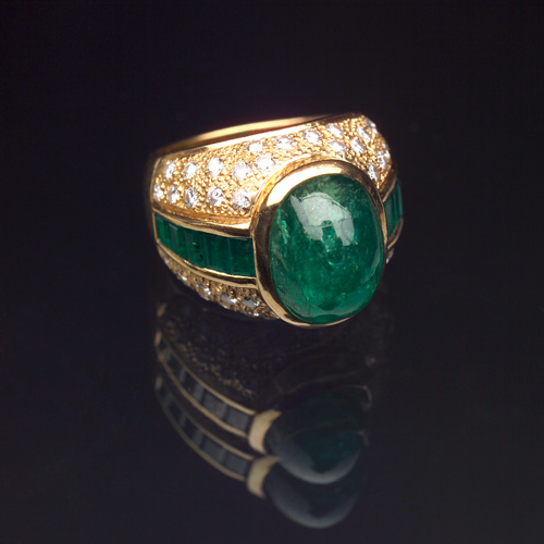 Appraisal: EMERALD AND DIAMOND Bomb ring in k yellow gold Oval