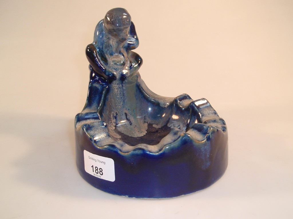 Appraisal: An Art Pottery ashtray modelled with a seated monkey to