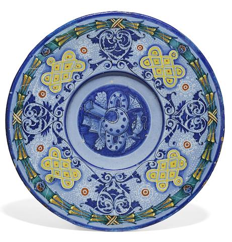 Appraisal: A Faenza dish decorated with a maiolica jug circa -