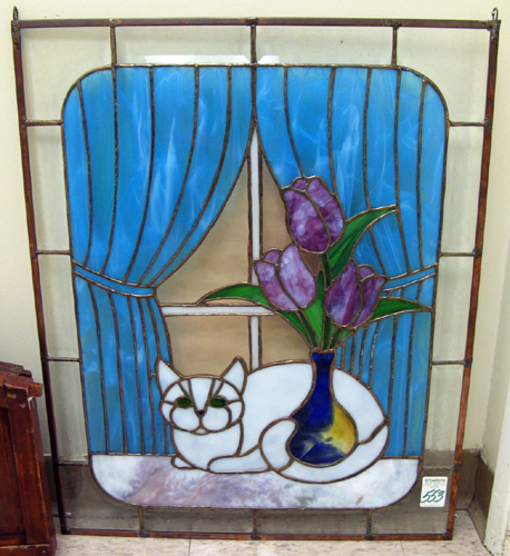 Appraisal: A STAINED AND LEADED GLASS WINDOW PANEL A vase with