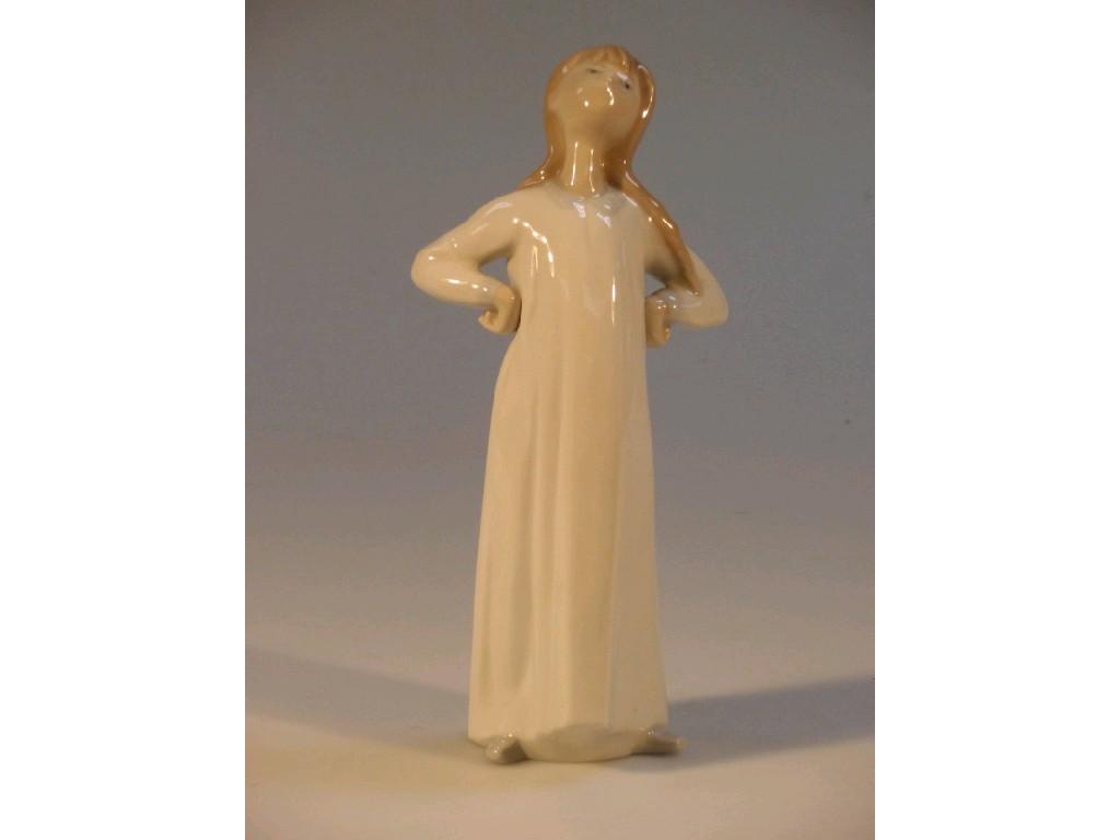 Appraisal: A Lladro figure of a young girl standing with her