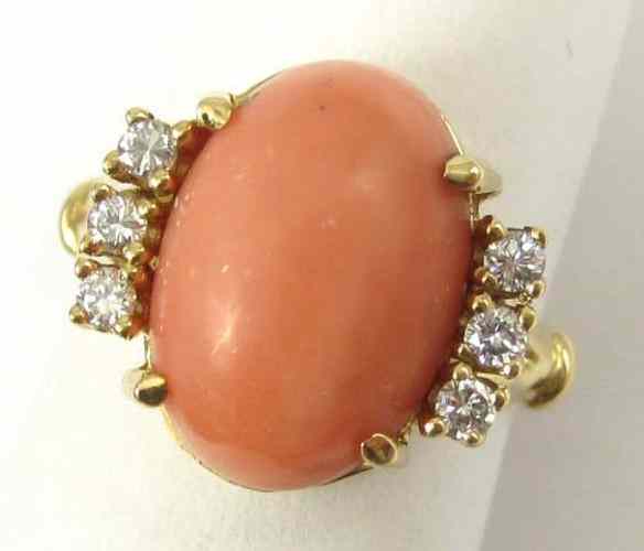 Appraisal: CORAL DIAMOND AND FOURTEEN KARAT GOLD RING set with three