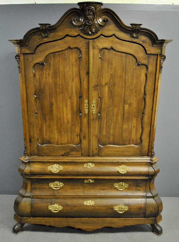 Appraisal: - Dutch pine two-piece bomb bookcase th c with an