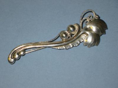 Appraisal: A GEORG JENSEN SILVER BROOCH modelled as stylised Lily of