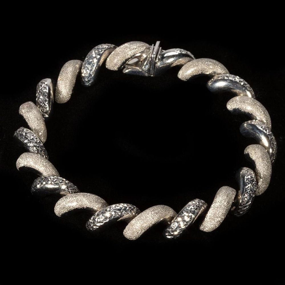 Appraisal: k white gold San Marco bracelet designed with alternating diamond-cut