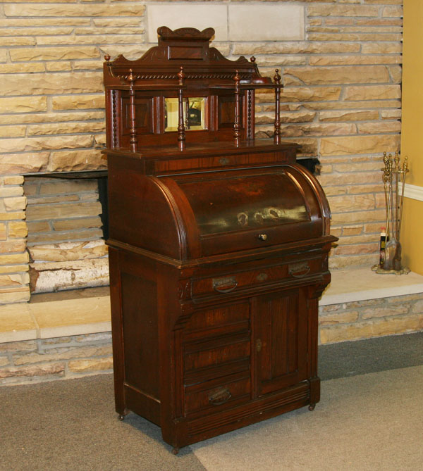 Appraisal: Victorian cylinder roll desk with gallery Eastlake-style burled walnut veneers