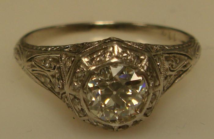 Appraisal: Platinum Diamond Ring Filigree setting with a bezel set center