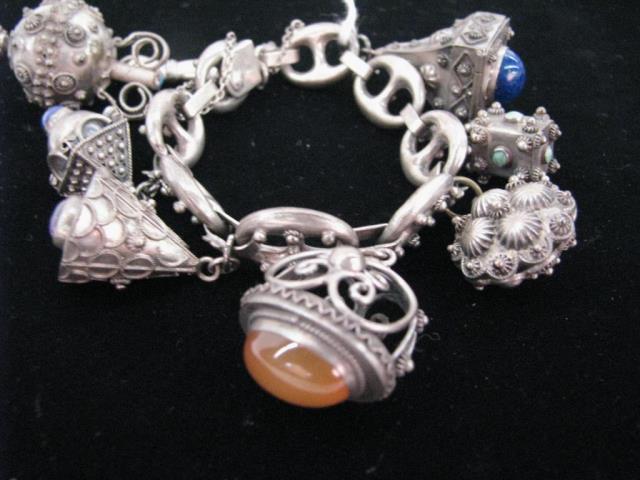 Appraisal: A vintage Italian silver charm bracelet marked on clasp Silver