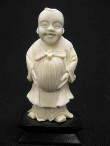 Appraisal: Chinese Carved Figurine of a Boywith melon '' plus wooden