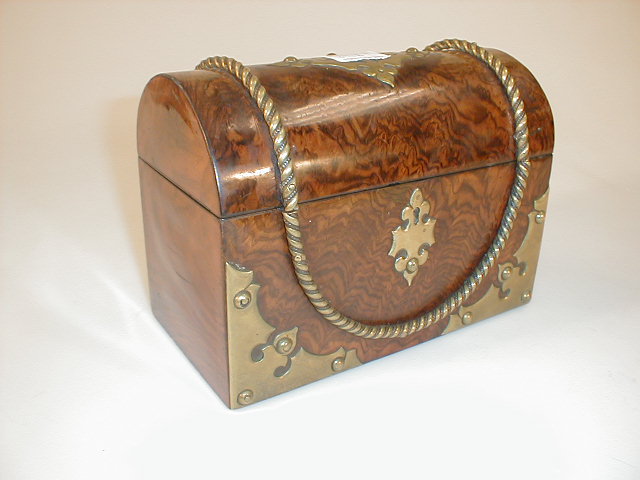 Appraisal: A Victorian brass bound walnut box with dome top and