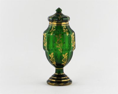 Appraisal: A green glass vase and cover the faceted sides painted