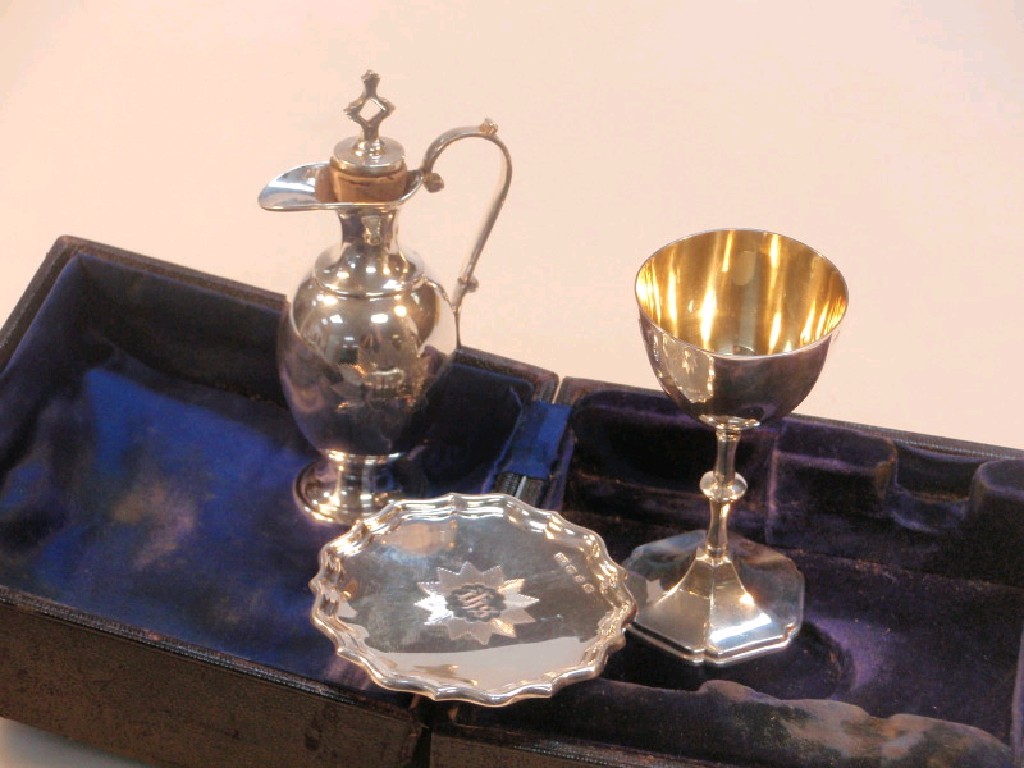 Appraisal: A late Victorian silver travelling communion set by Colen Hewer