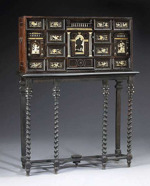 Appraisal: A Continental Baroque bone and ivory inlaid walnut cabinet on