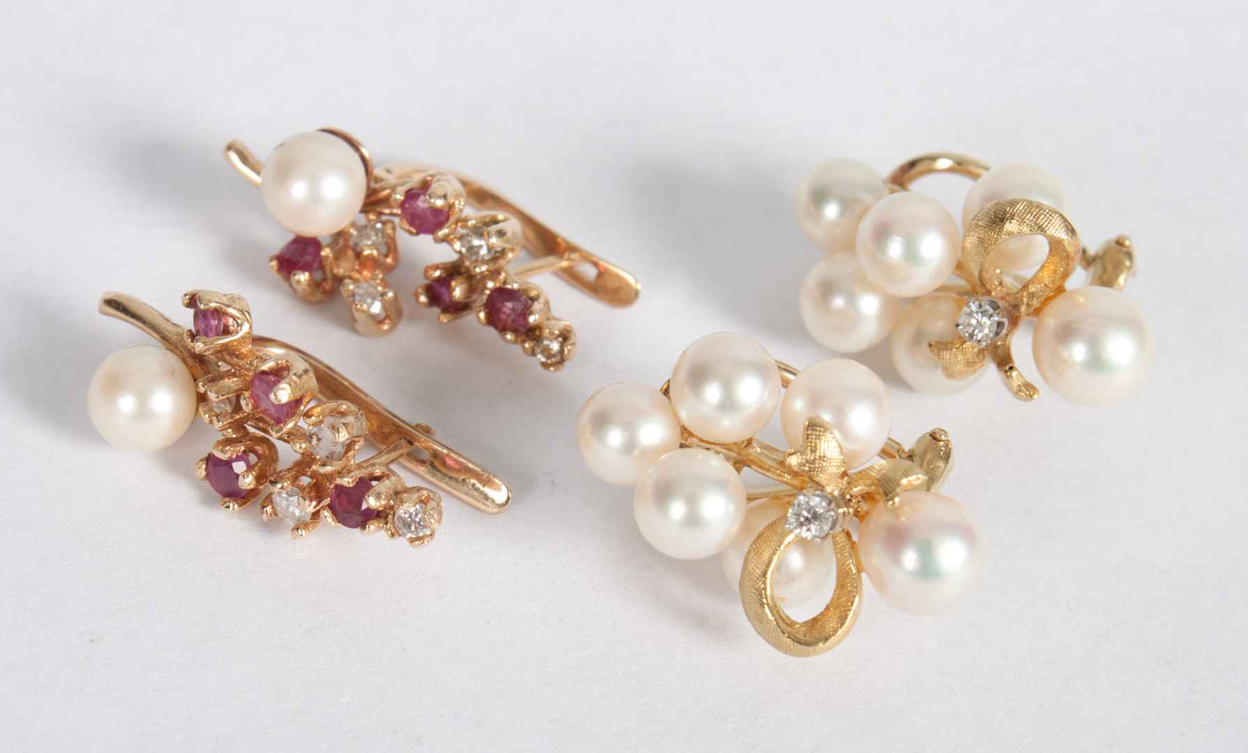 Appraisal: Two pairs of K pearl diamond and ruby earrings pair