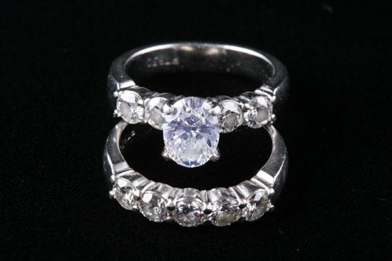 Appraisal: PLATINUM AND DIAMOND ENGAGEMENT RING WITH MATCHING DIAMOND BAND Oval