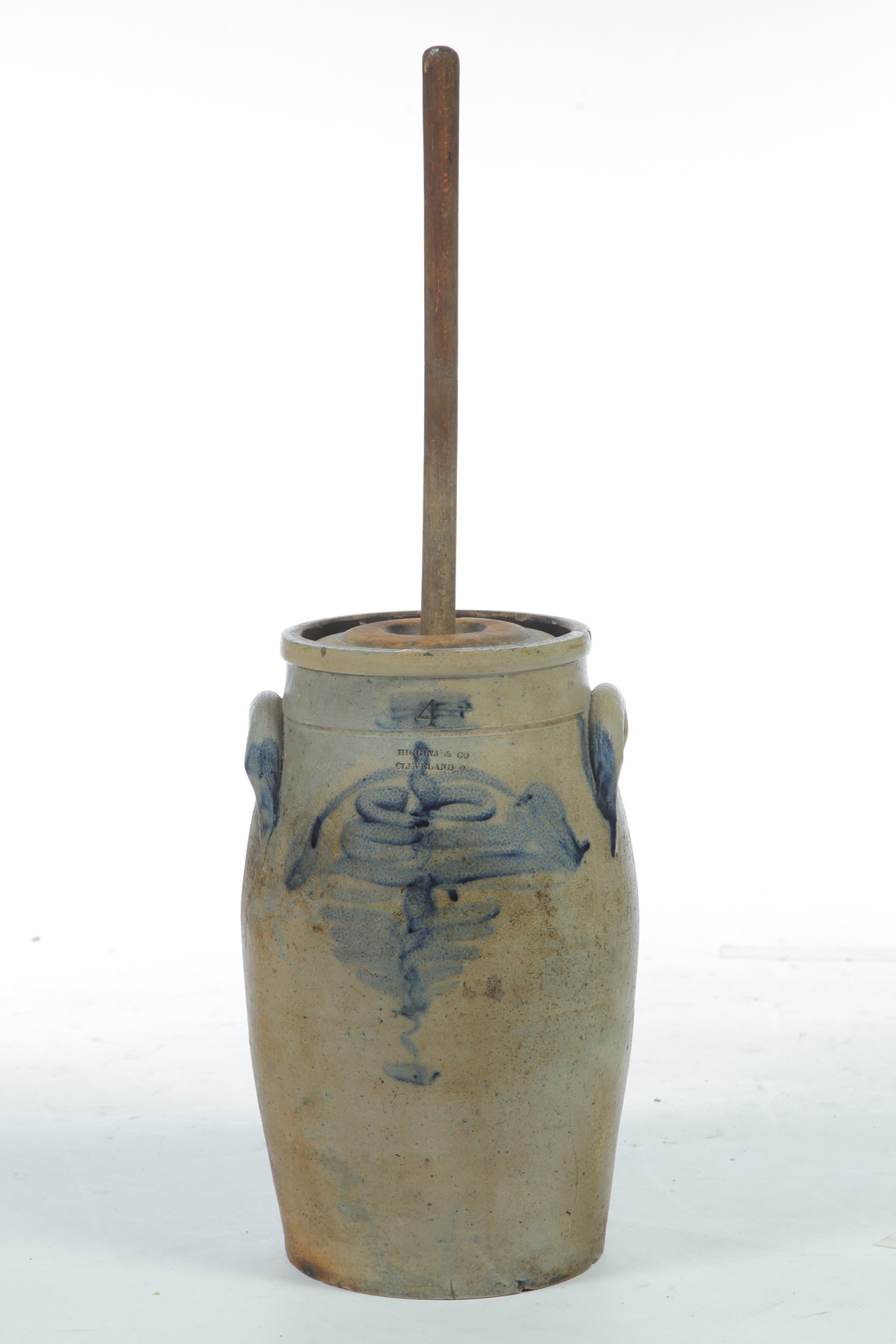 Appraisal: STONEWARE CHURN BY HIGGINS American mid th century Cobalt decoration