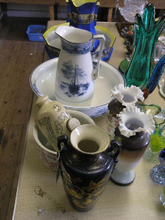 Appraisal: A pair of Victorian opaque glass vases painted with flowers