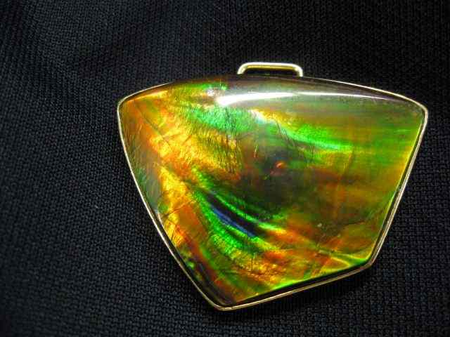 Appraisal: Brown Semi-Crystal Opal Pendant carat fiery gem with red orange