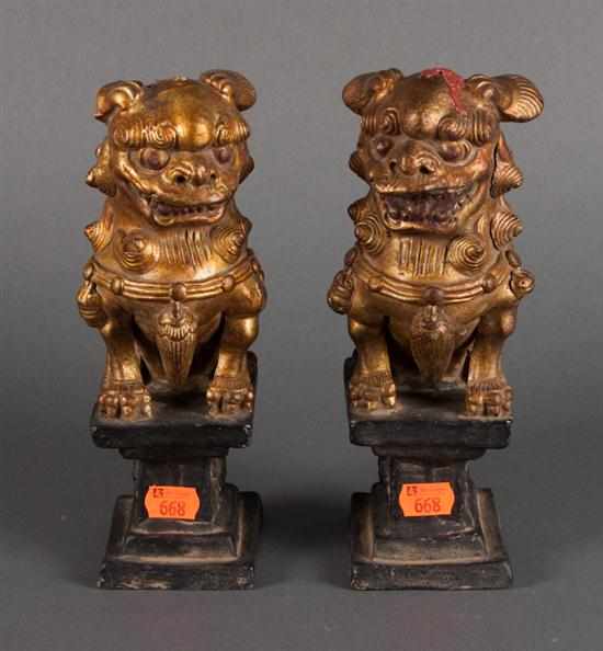 Appraisal: Pair of Chinese gilt and painted foo dogs in H