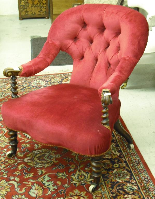 Appraisal: Victorian button-back upholstered armchair with scrolling arms over rosewood barley