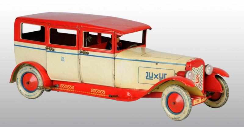 Appraisal: Tin Lehmann Luxus Automobile Wind-Up Toy Description German Working Original