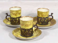 Appraisal: Three Staffordshire porcelain cups in silver holders hallmarked by William