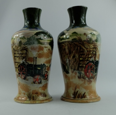 Appraisal: Pair Cobridge stoneware vases decorated with tractor and haymaking scenes