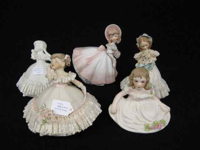 Appraisal: Porcelain Figurines of Young Girls fancy lace work by Almn