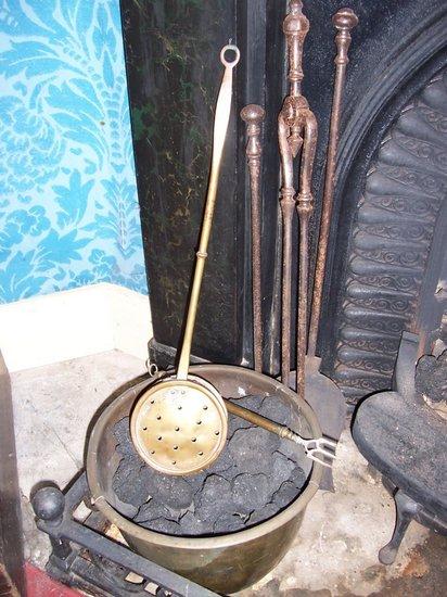 Appraisal: A set of steel fire irons comprising tongs poker and