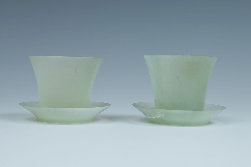 Appraisal: PAIR OF JADE WINE CUPS Each cup of deep bell-shape