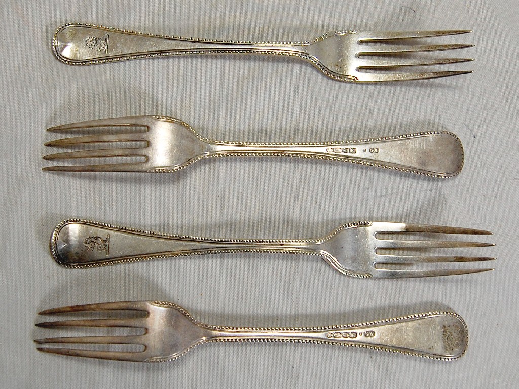 Appraisal: Four Victorian silver bead-edge dessert forks bearing crest London three