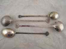 Appraisal: A pair of Chinese serving spoons test silver and two