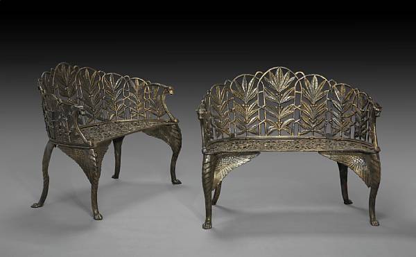 Appraisal: A pair of Neoclassical style cast iron garden benches The