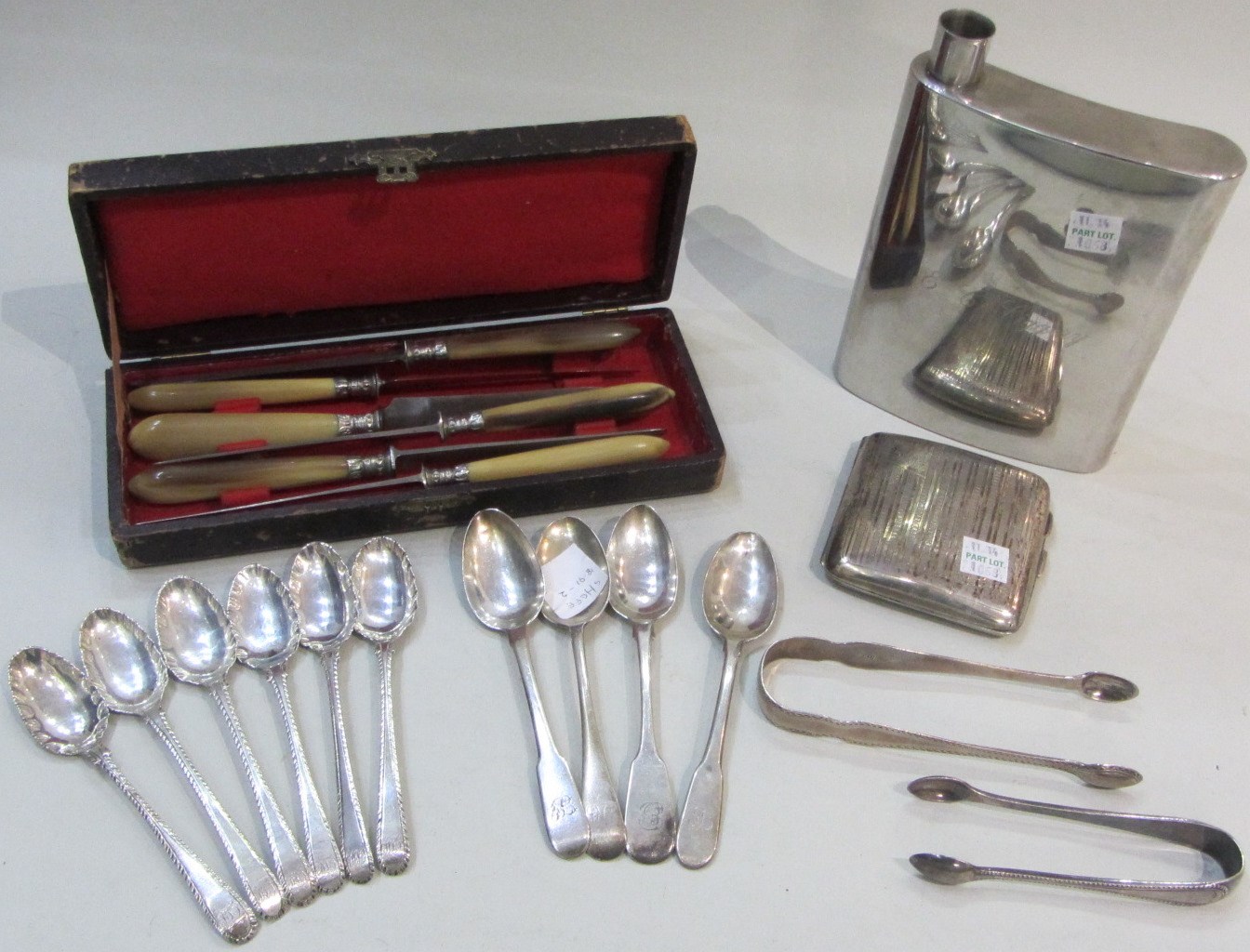 Appraisal: Silver comprising a pair of George III sugar tongs with