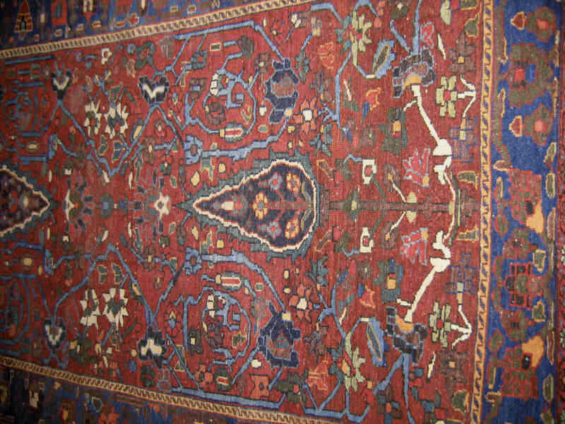 Appraisal: PERSIAN THROW RUG PERHAPS BAKHITARI The abrashed madder red to