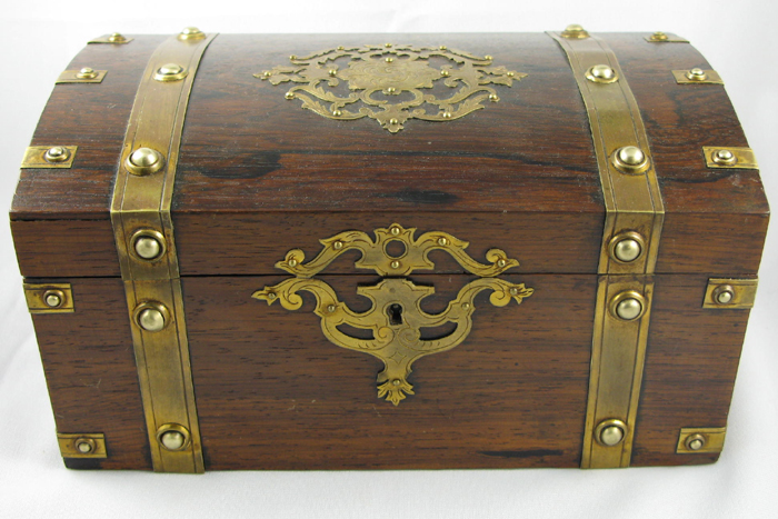 Appraisal: A MAHOGANY JEWELRY OR TREASURE BOX having brass bands and