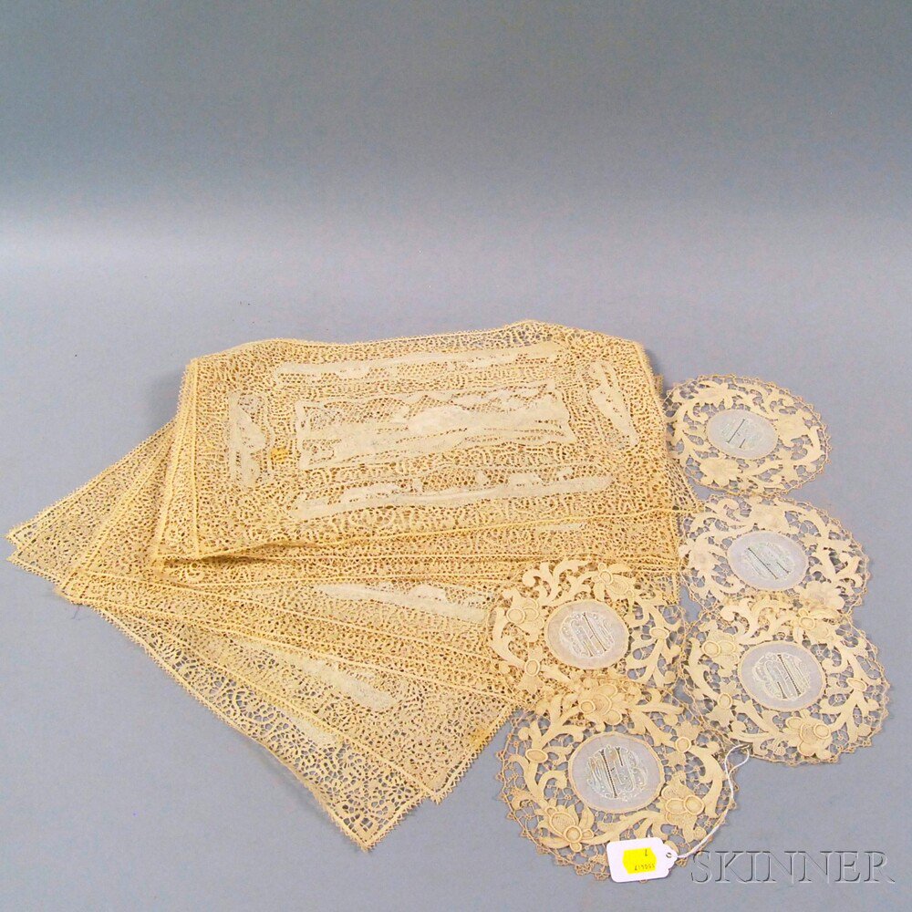 Appraisal: Twelve Ivory Lace Placemats with central elephant-decorated lace panel x