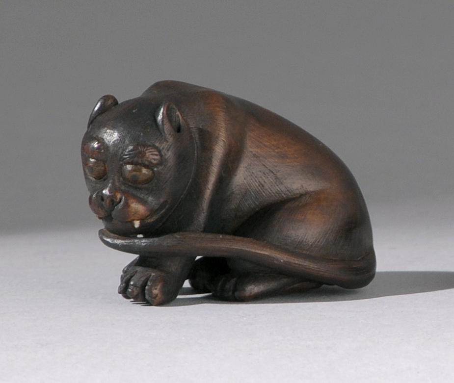 Appraisal: WOOD NETSUKE th CenturyBy Tomokazu Depicting a seated tiger with