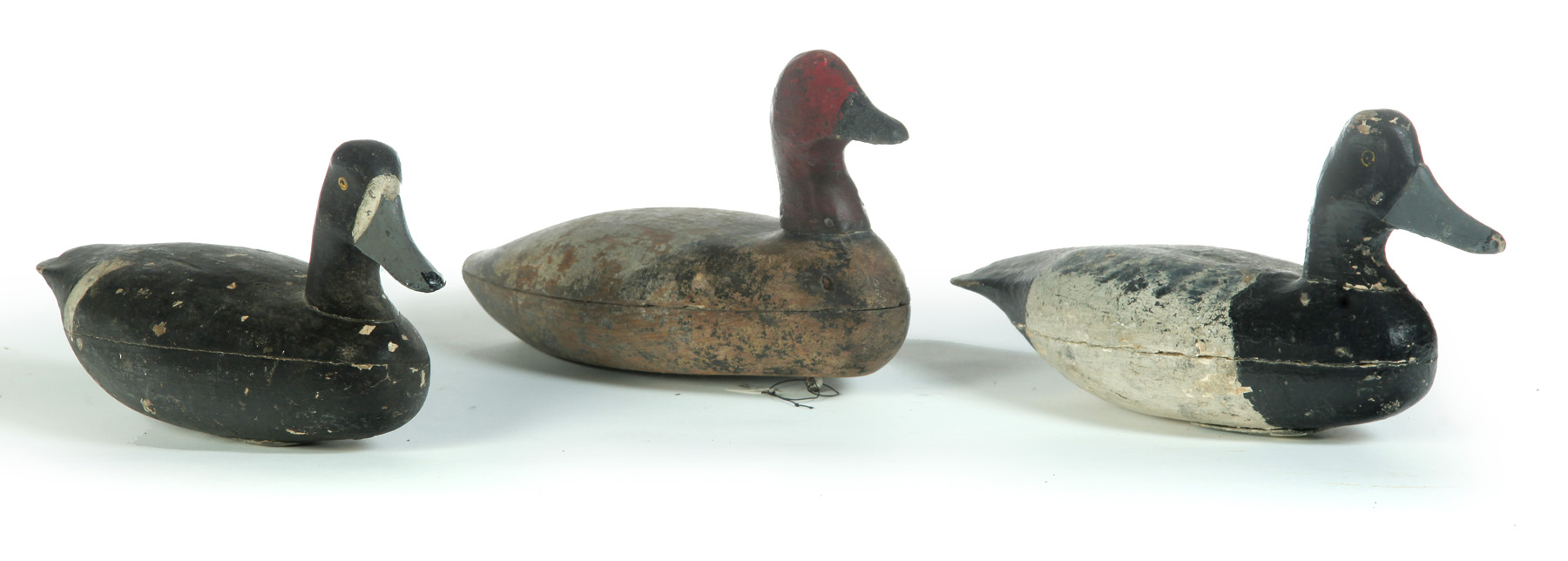 Appraisal: THREE NEW JERSEY HOLLOW DIVING DUCK DECOYS American late th