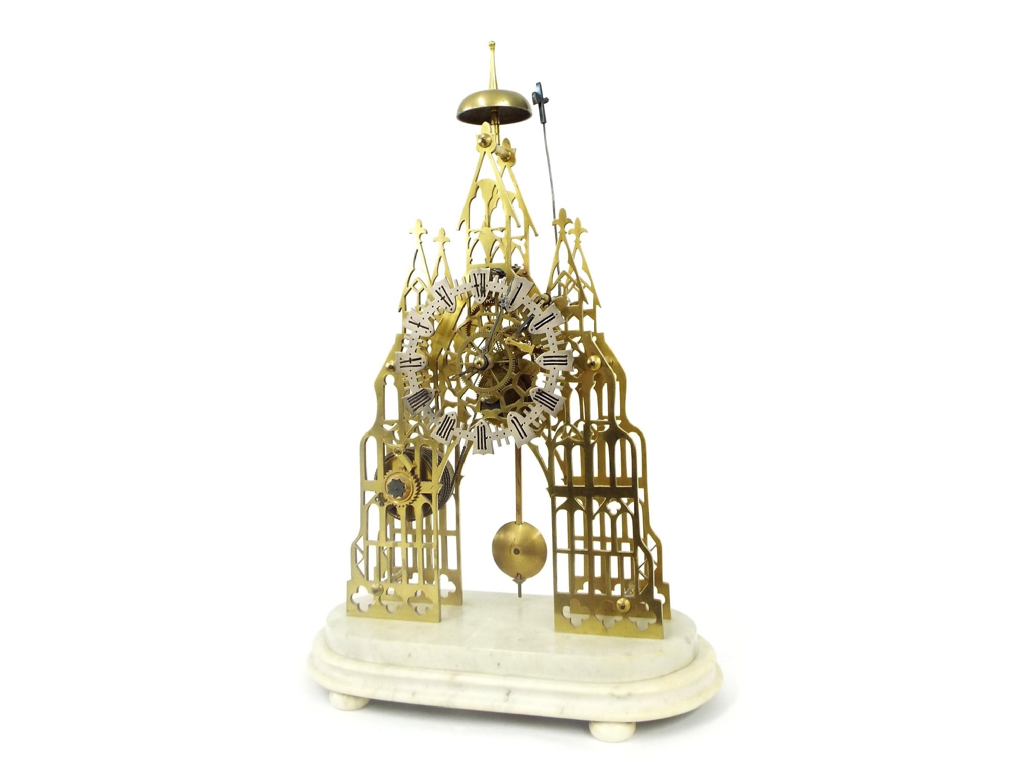 Appraisal: Brass Cathedral single fusee skeleton clock with passing strike the