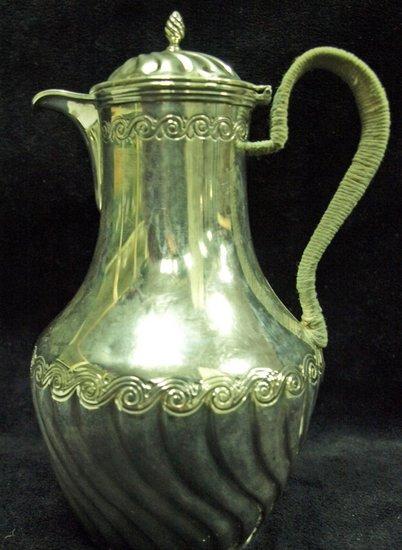 Appraisal: A Victorian pear shaped coffee pot engraved bands of scrolls