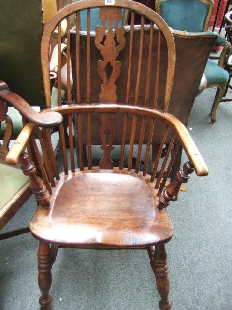 Appraisal: An early th century ash and elm Windsor chair with