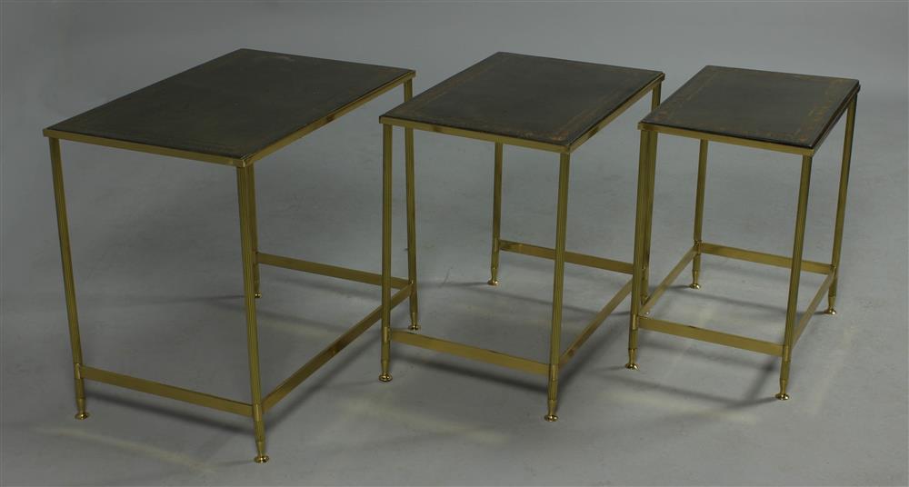 Appraisal: TRIO OF GILT EMBOSSED LEATHER TOPPED BRASS NESTING TABLES green