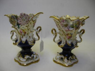 Appraisal: A PAIR OF STAFFORDSHIRE PORCELAIN VASES of shaped campana form