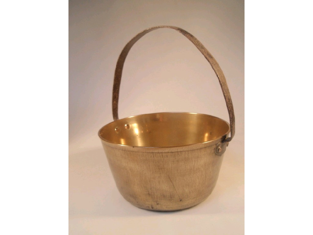 Appraisal: A brass jam pan with fixed overhead iron handle diameter