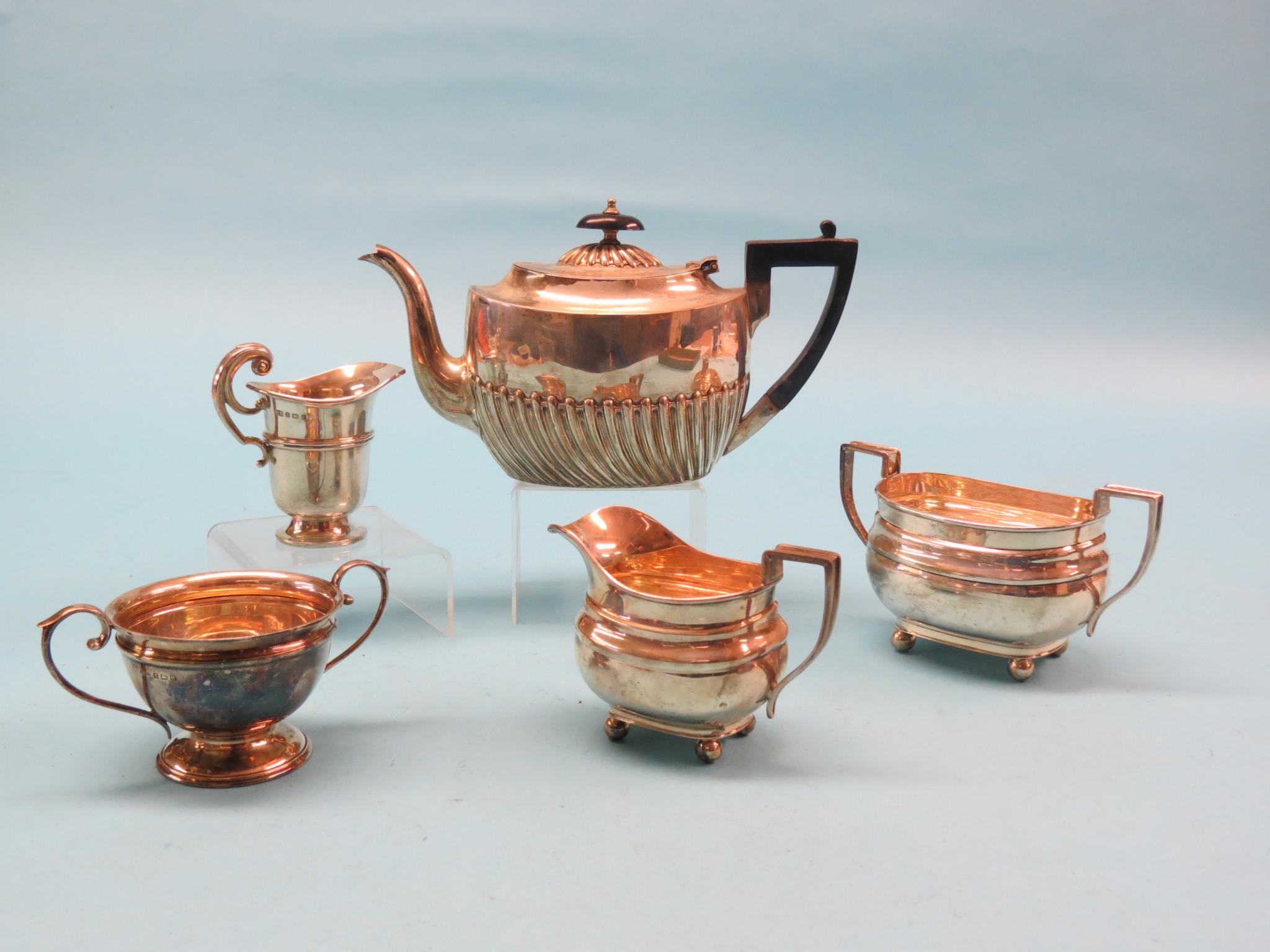 Appraisal: Silver teaware half-wrythen teapot two twin handled sugar bowls milk