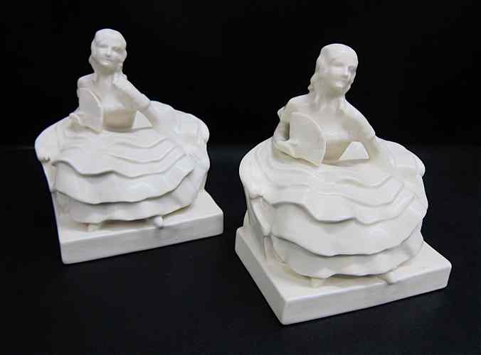 Appraisal: PAIR ROOKWOOD ART DECO POTTERY FIGURAL BOOK ENDS in the