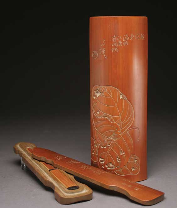 Appraisal: WRISTREST AND LETTER OPENER Two well carved and stained Chinese