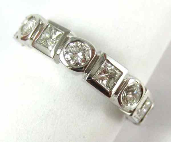 Appraisal: DIAMOND AND FOURTEEN KARAT WHITE GOLD RING set with four